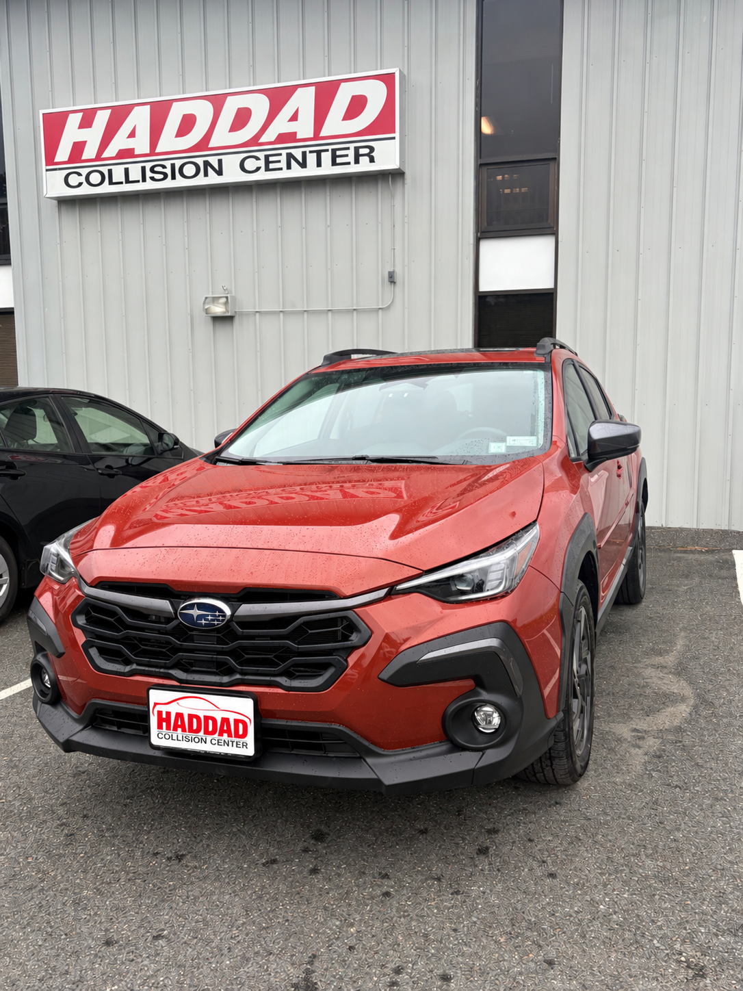 Orange Subaru after collision repair