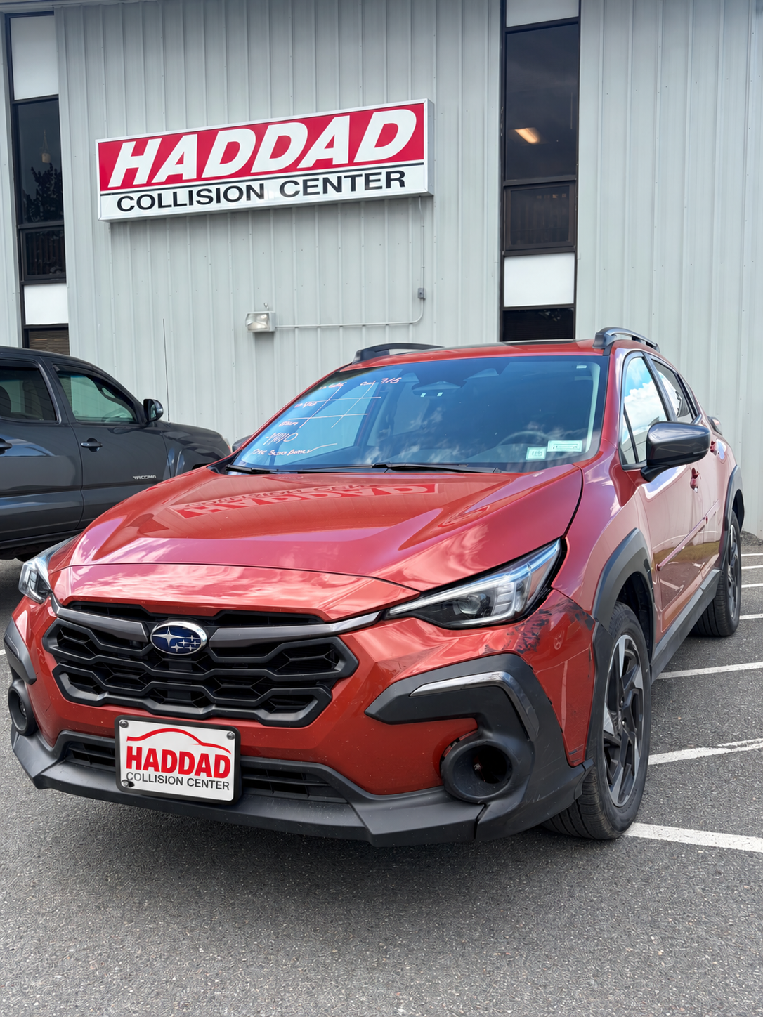 Orange Subaru before collision repair