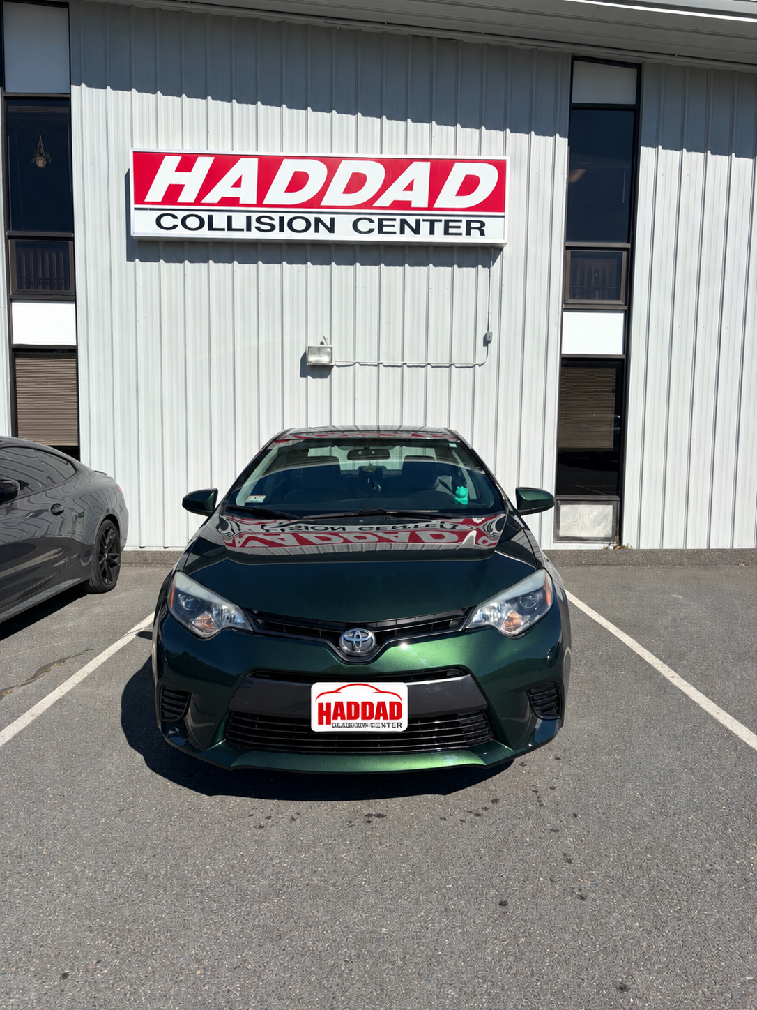 Green Toyota Sedan after collision repair
