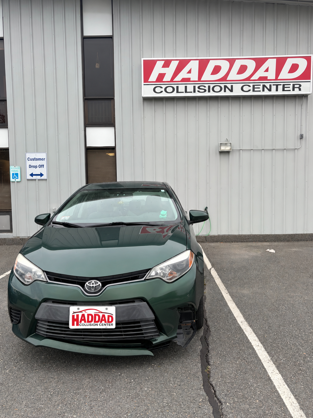 Green Toyota Sedan before collision repair